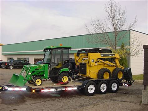 strapping a skid steer|how to tie skid steer loader.